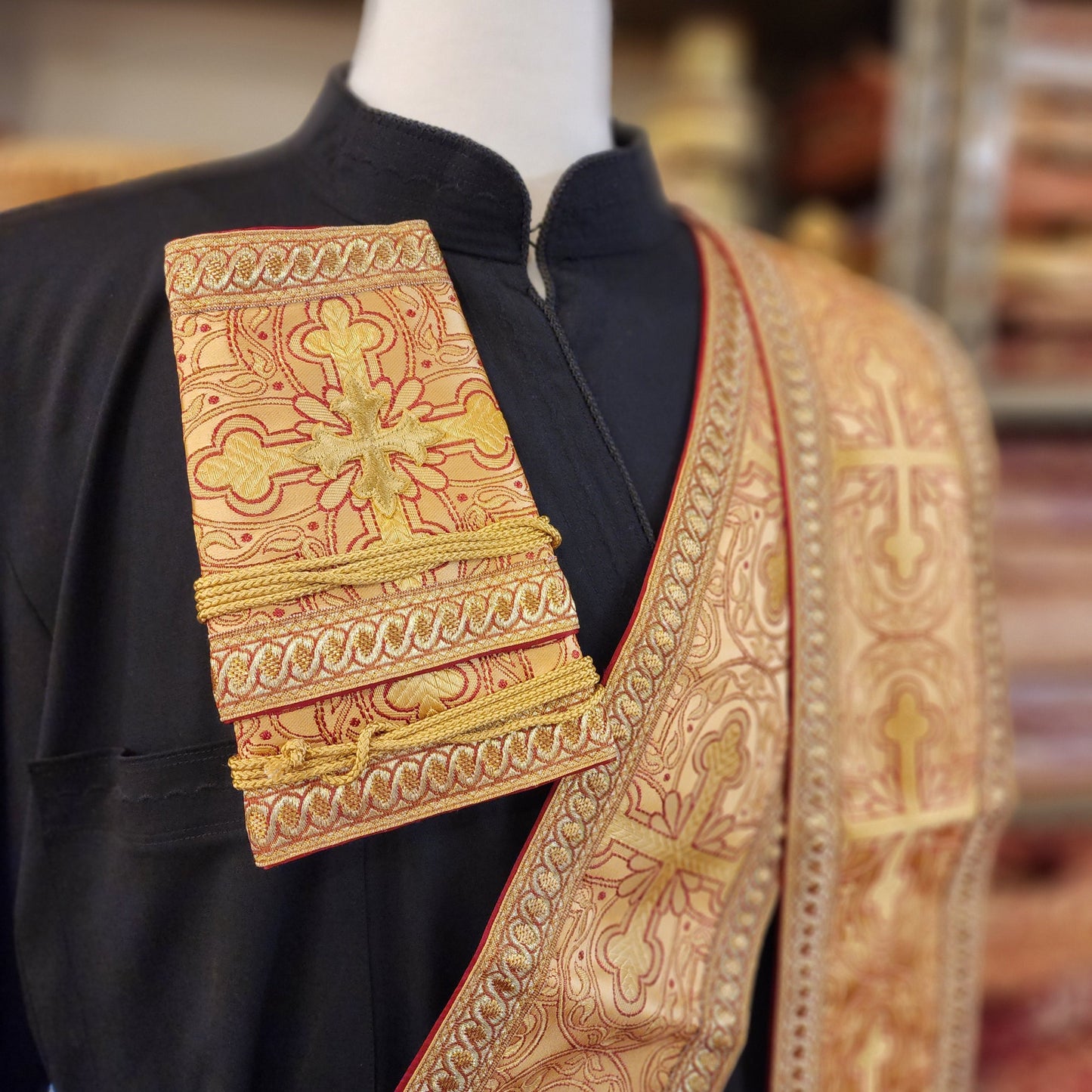Greek Orthodox deacon orarion and cuff set on tailors form with Greek cassock